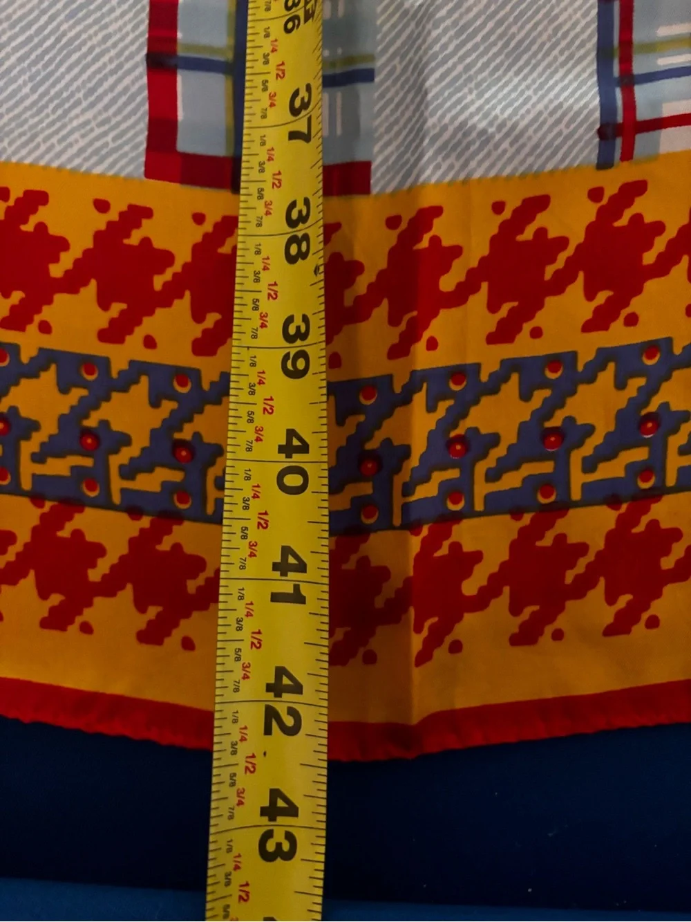 vibrant red and yellow houndstooth pattern scarf